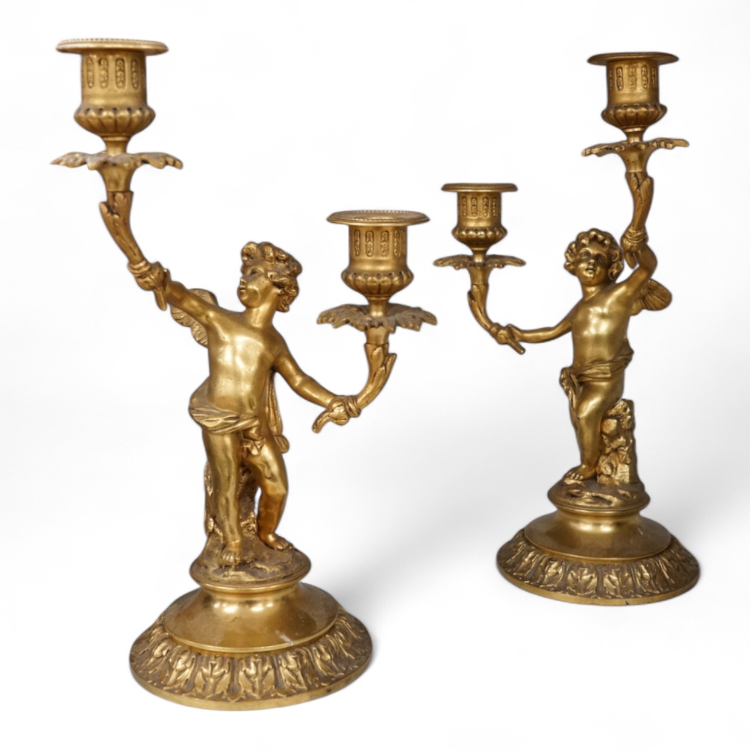 A pair of 19th century ormolu twin-branch cherub candlesticks, 28.5cm